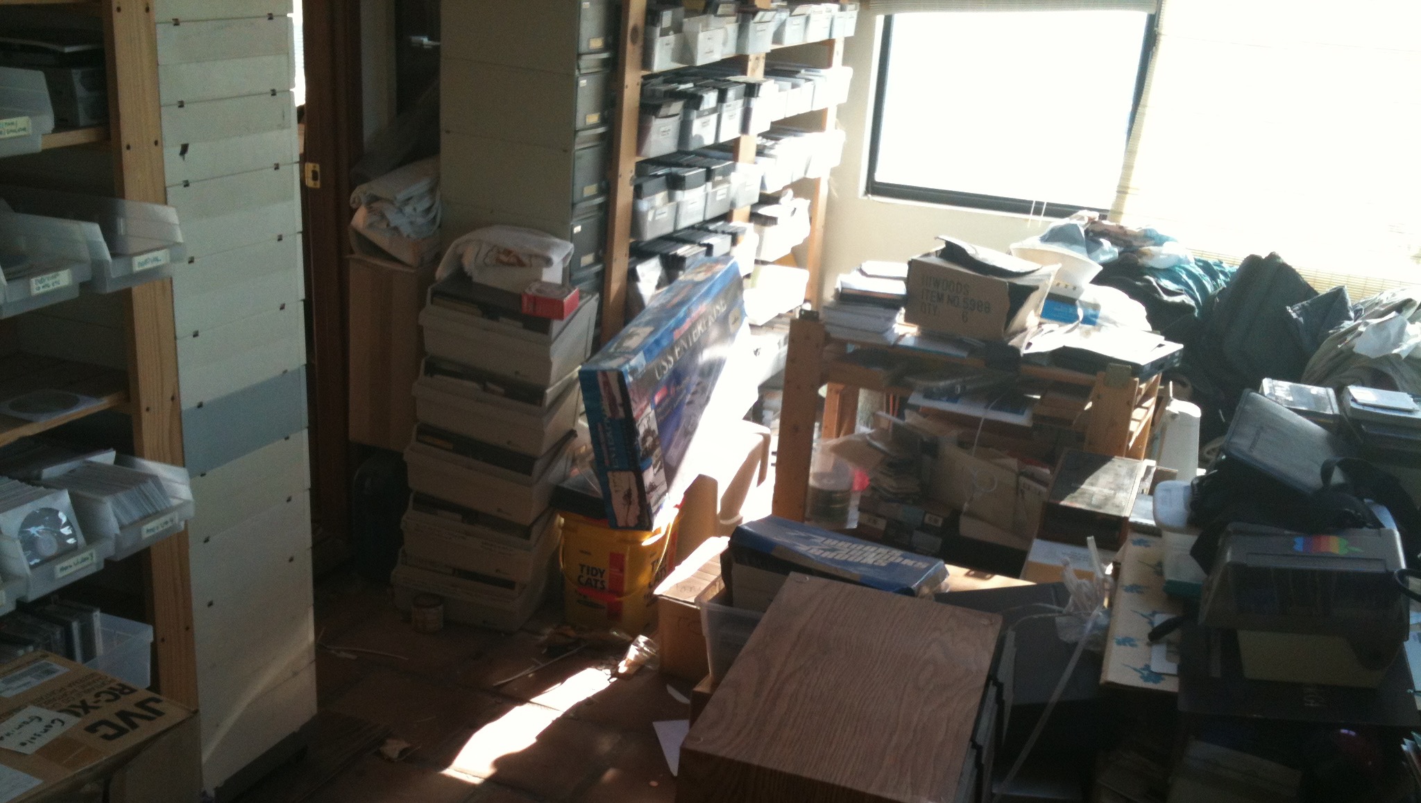 Piles of Apple II hardware and software in a house