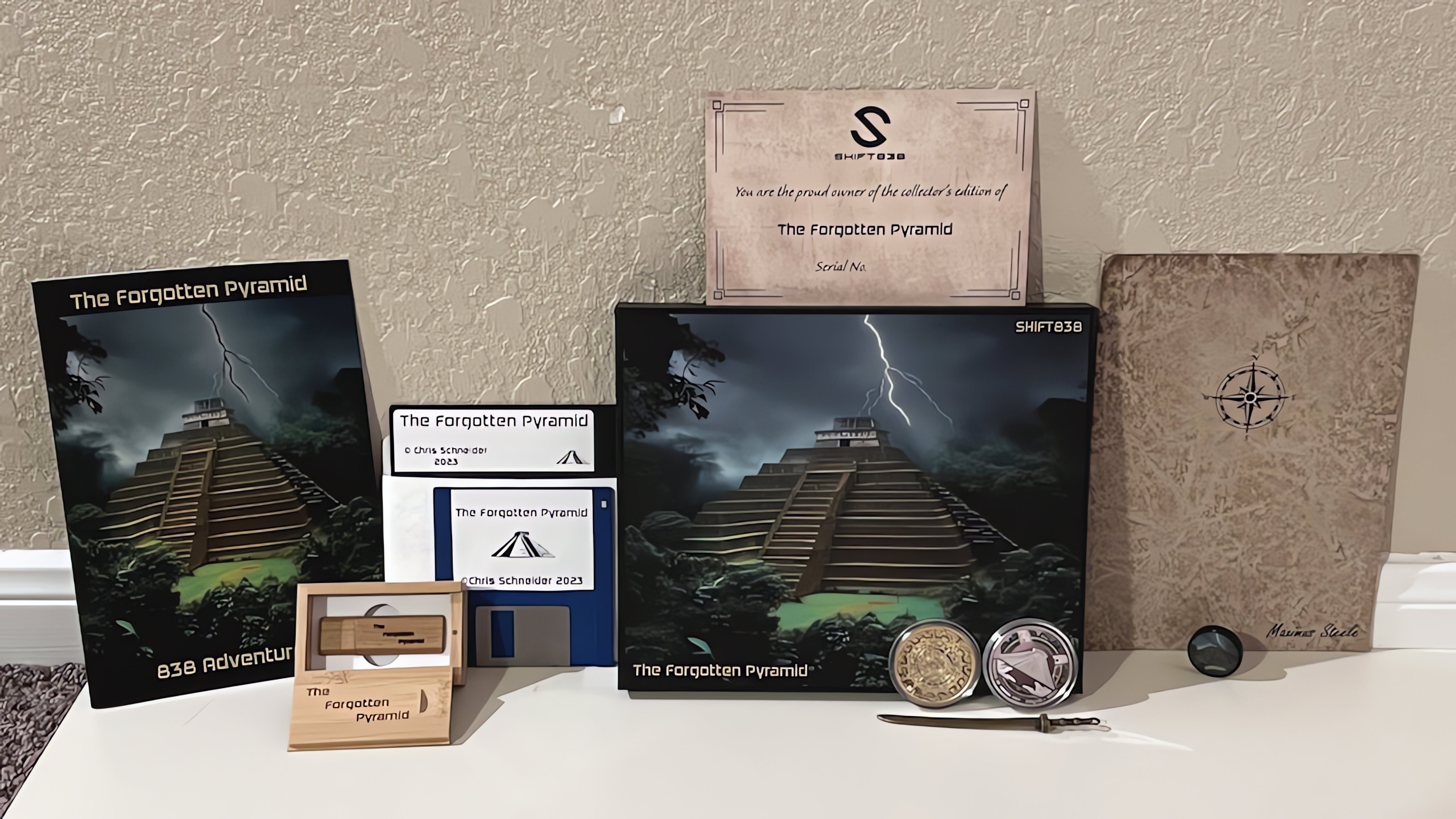 An arrangement of boxes, manuals, and USB drives representing various Kickstarter reward tiers
