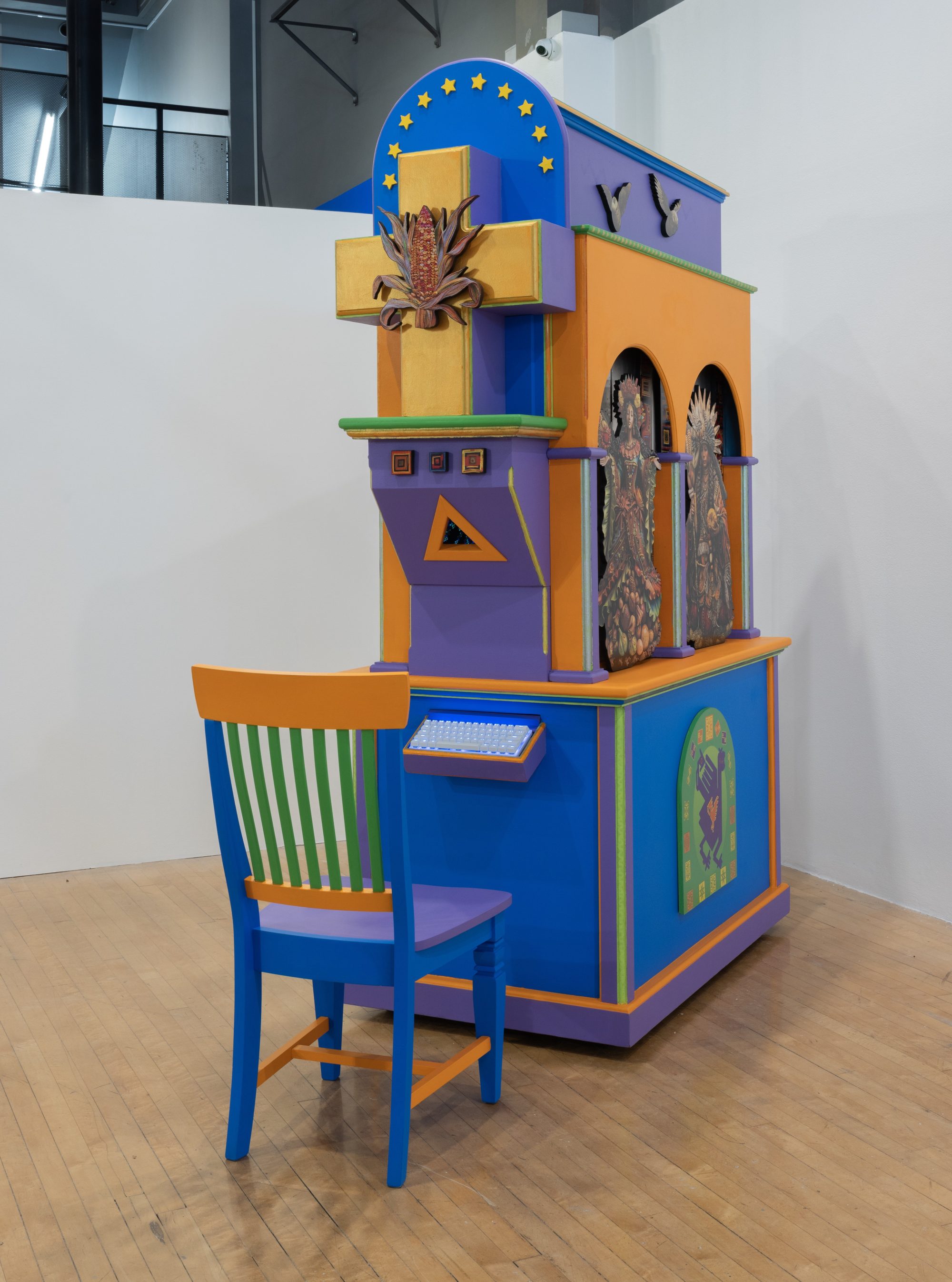 A colorful cabinet with a wooden chair in front of it