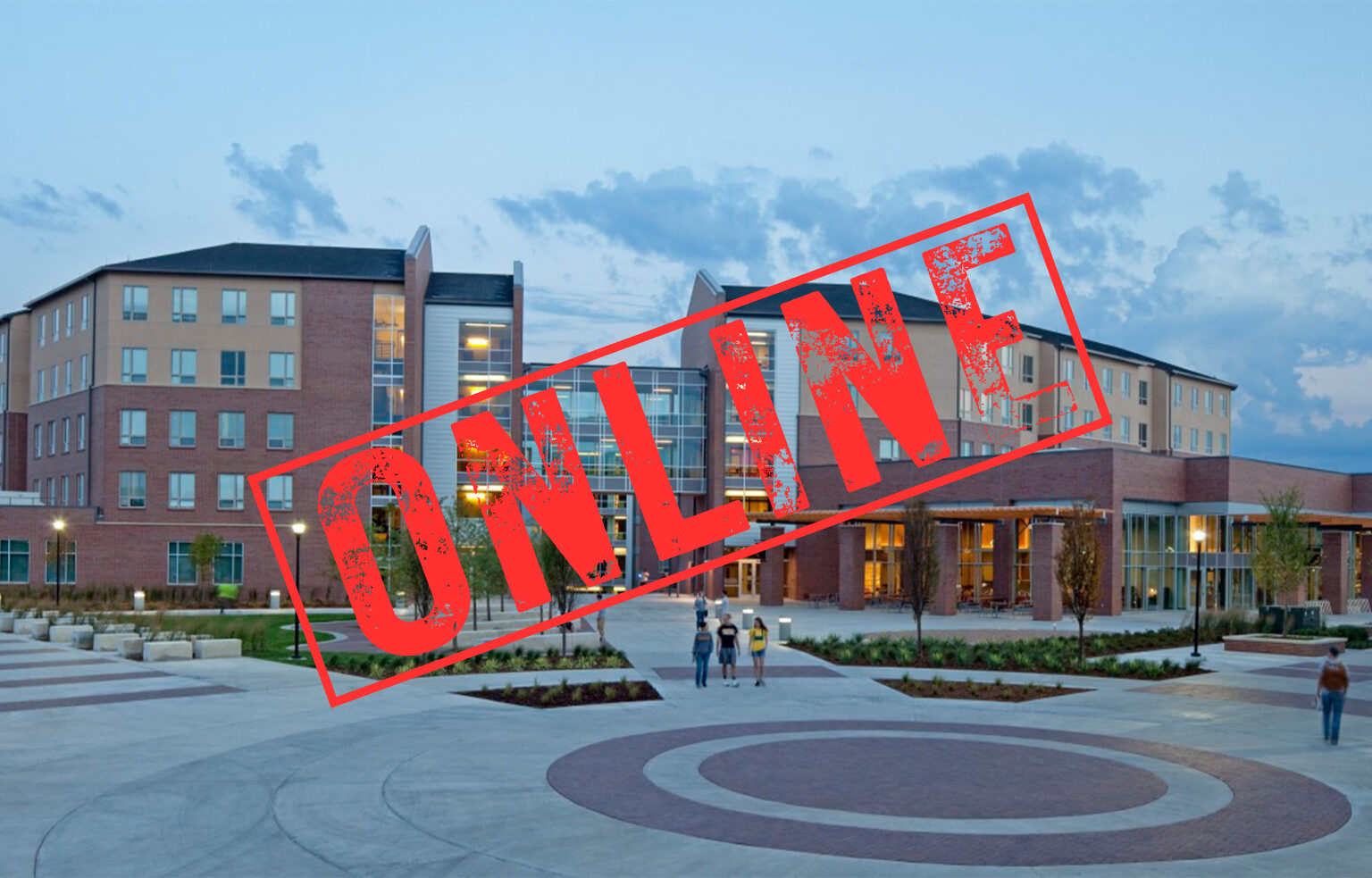 The outside of a college dormitory building with a stamp of the word ONLINE