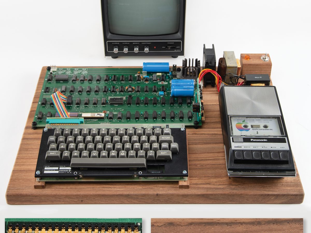 An Apple-1 computer complete with monitor, keyboard, cassette drive, and wooden mount, autographed by Steve Wozniak and Daniel Kottke