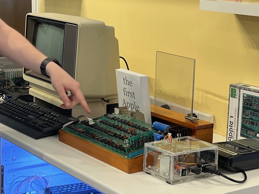 A finger points at an Apple-1 replica computer
