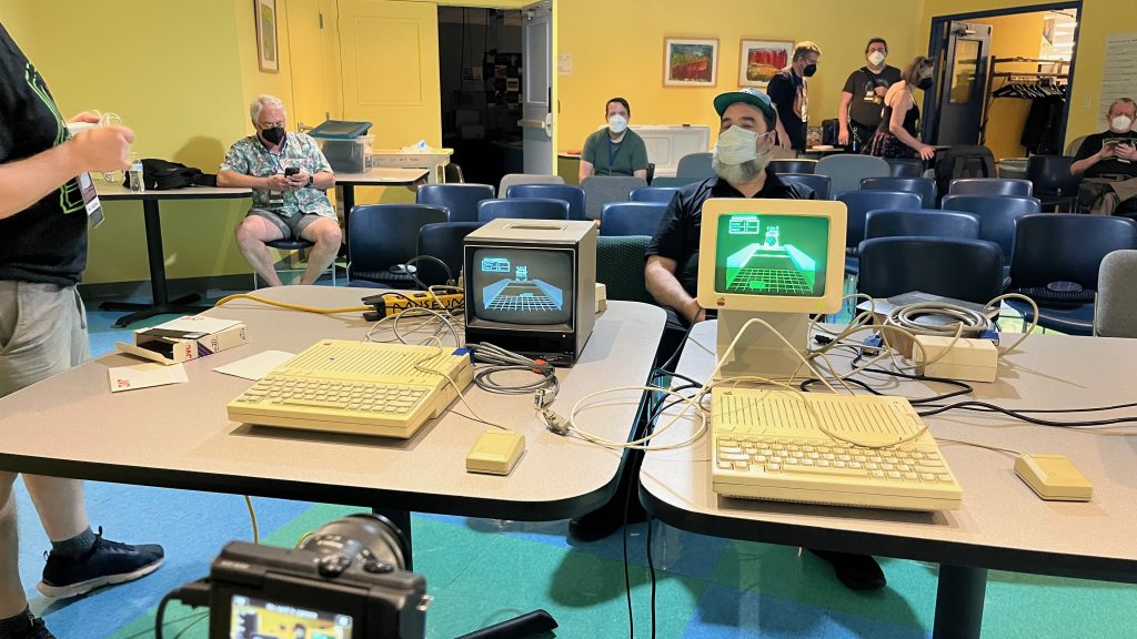 Two Apple IIc computers set up to play Shufflepuck Cafe